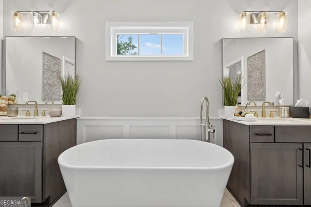 a bedroom with a bed and a flat screen tv in it