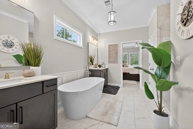 a bathroom with a granite countertop sink a toilet and shower