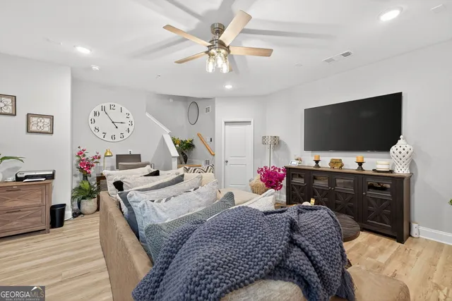 a view of a large yard with plants and a fountain