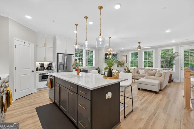 a kitchen with a table and chairs in it