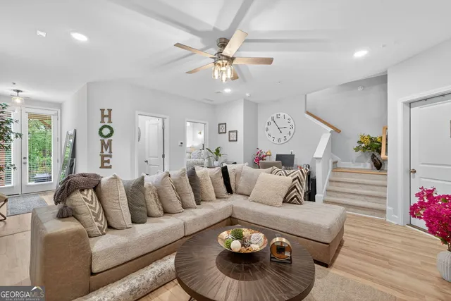 a front view of a house with a yard outdoor seating and garage