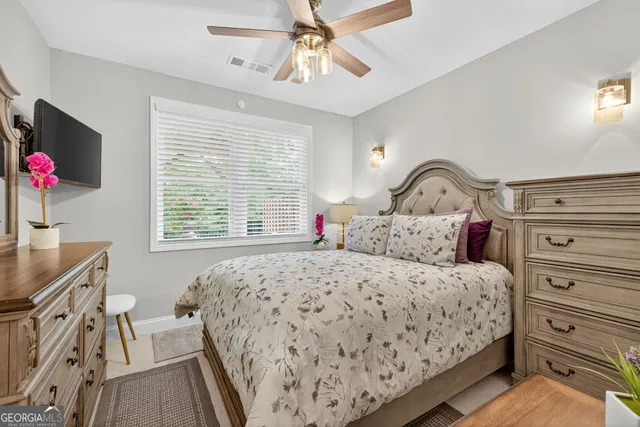 an aerial view of a house with outdoor space and a lake view