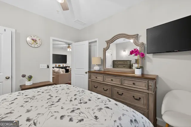 an aerial view of a house with a garden and lake view