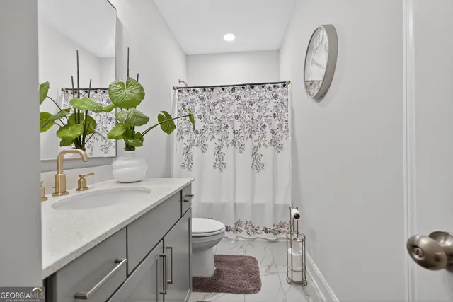 an aerial view of a house with swimming pool and a yard