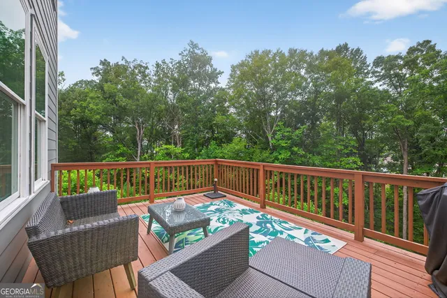 an aerial view of residential house with outdoor space and outdoor seating