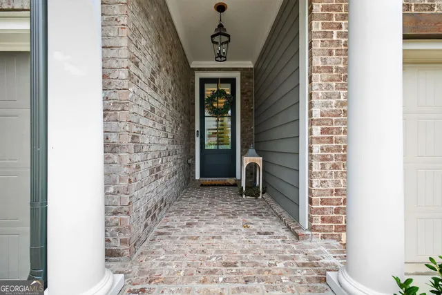 an aerial view of a house a yard and garden