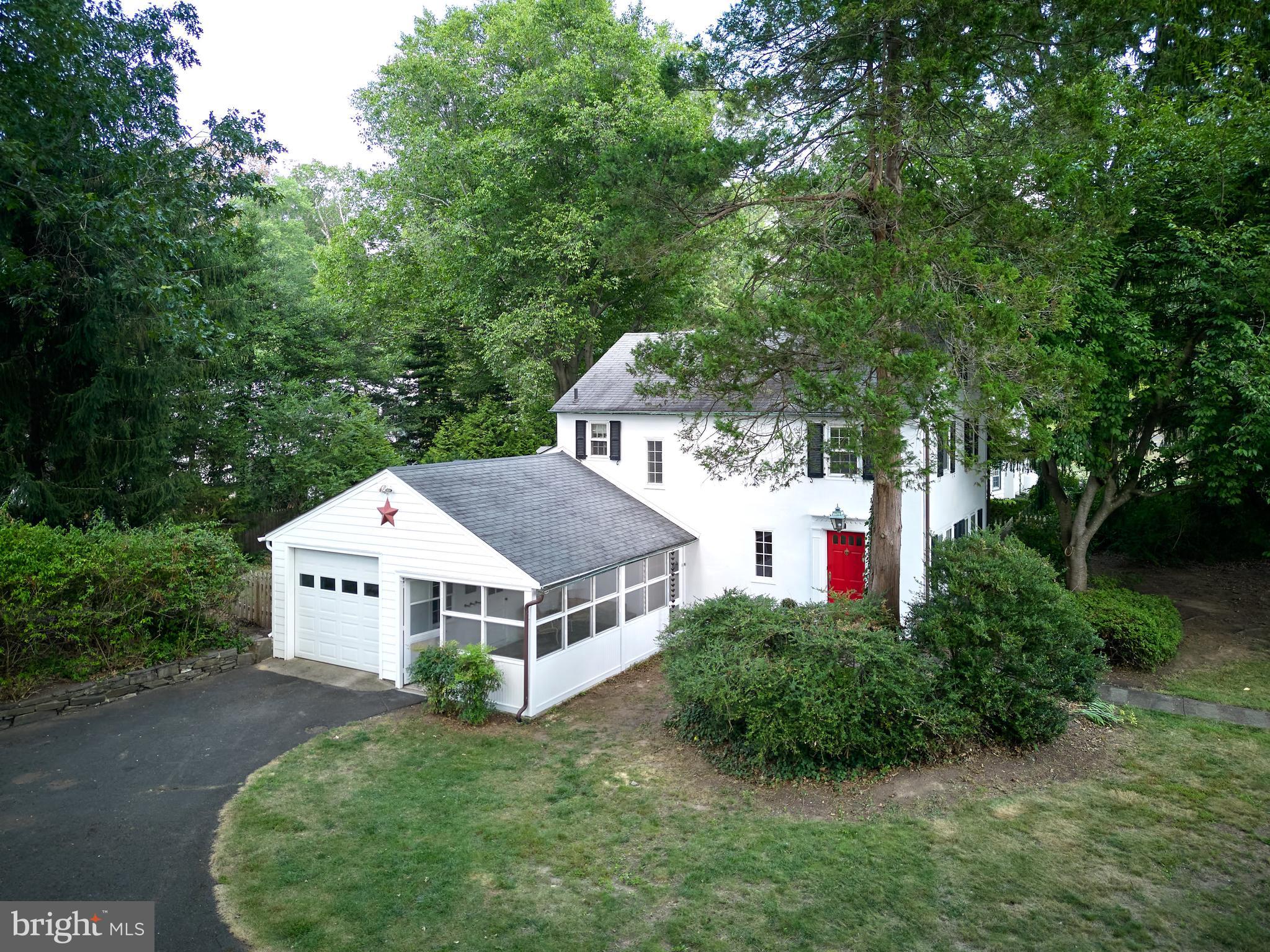 Exterior showing garage and screened patio