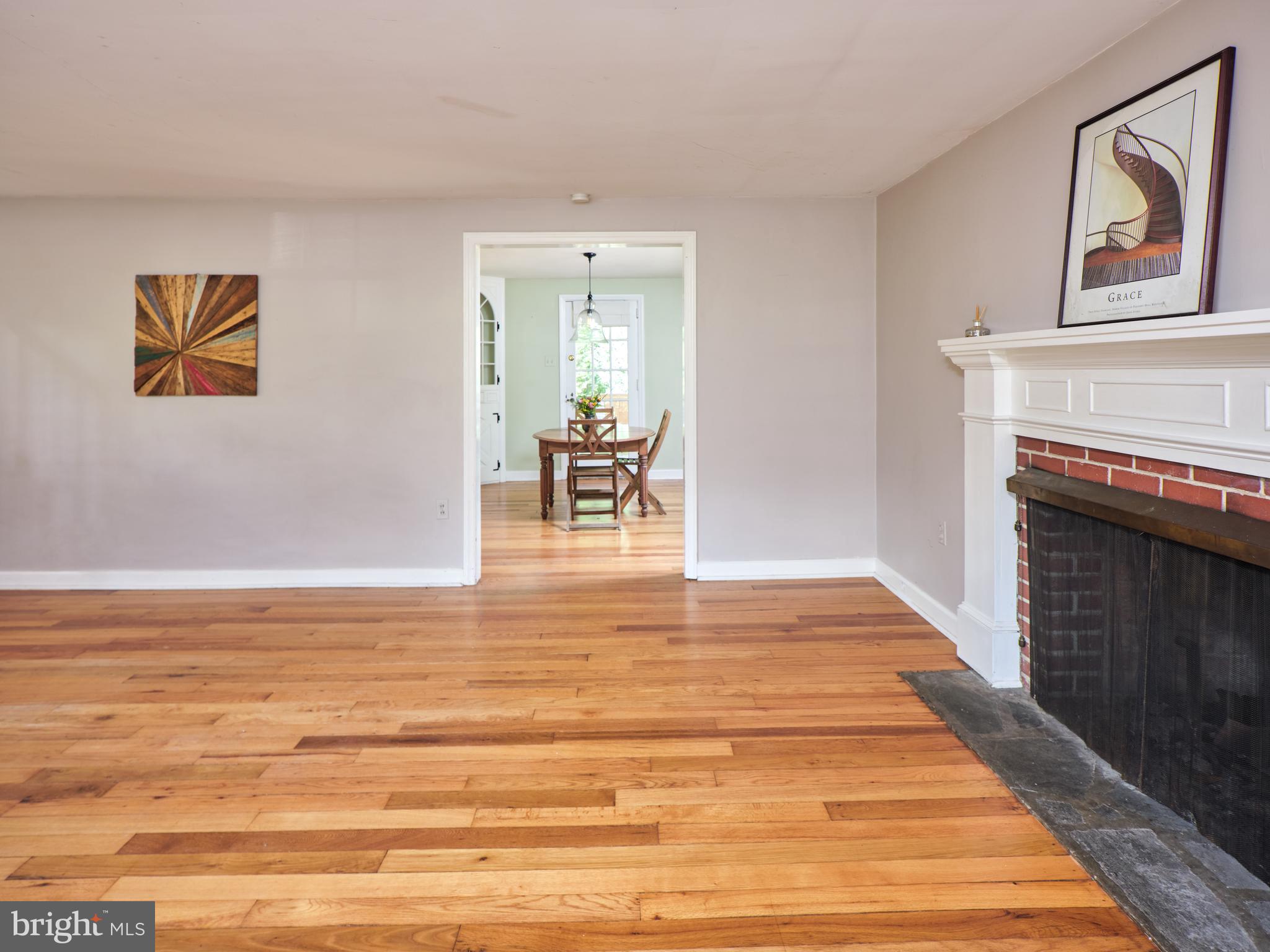 132 Beulah Road Doylestown, PA 18901 - Photo 10 of 29 Living room with hardwood floors and fireplace