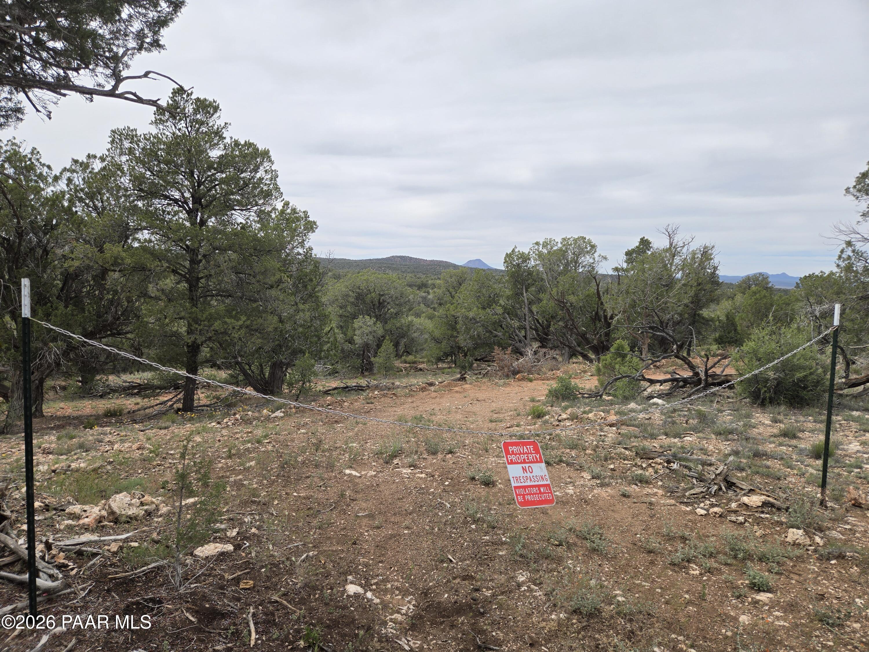 61 Raney Road Ash Fork, AZ 86320 - Photo 18 of 19 a backyard of a house with table and chairs