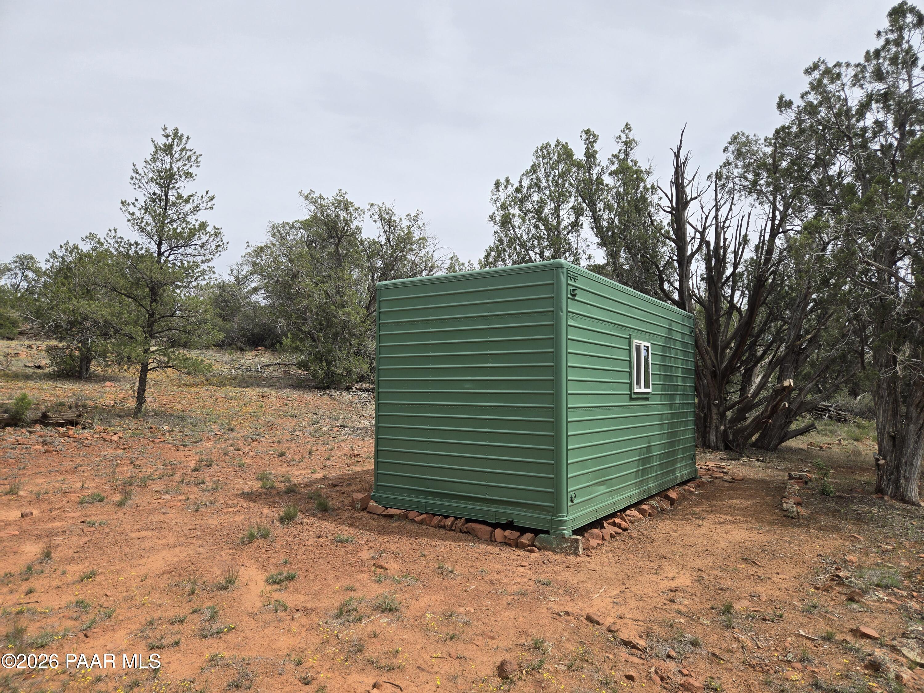 61 Raney Road Ash Fork, AZ 86320 - Photo 3 of 19 a view of a back yard of the house