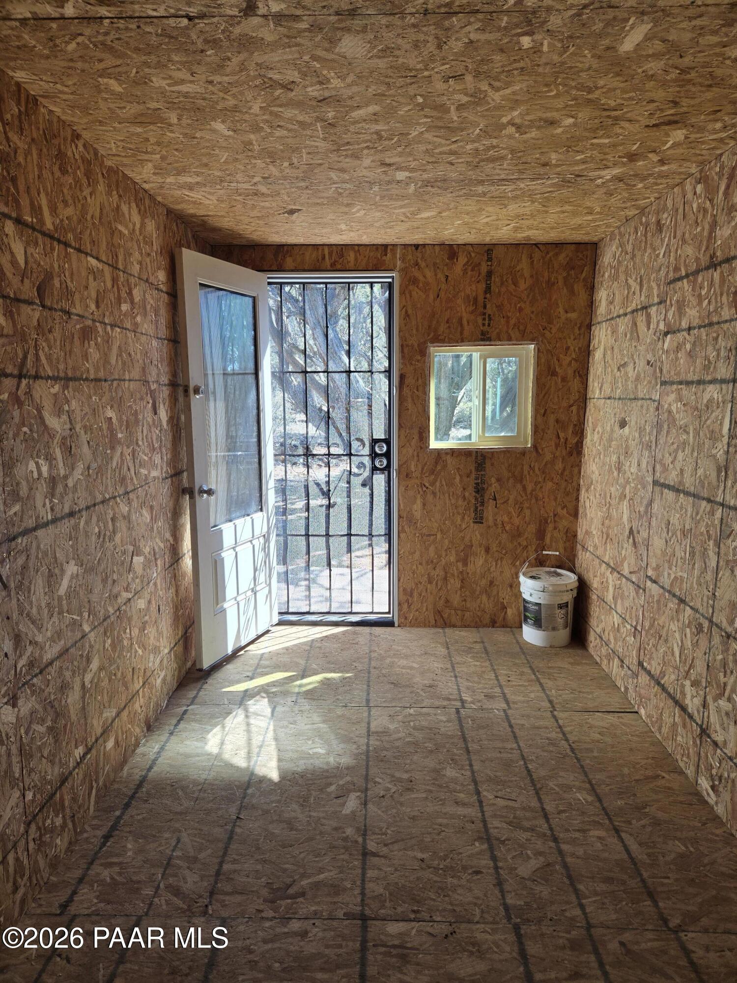 61 Raney Road Ash Fork, AZ 86320 - Photo 6 of 19 a view of an empty room with windows