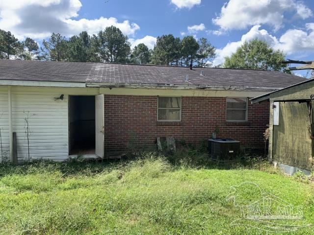 3281 Mason Road Walnut Hill, FL 32568 - Photo 13 of 41 a backyard of a house with lots of green space