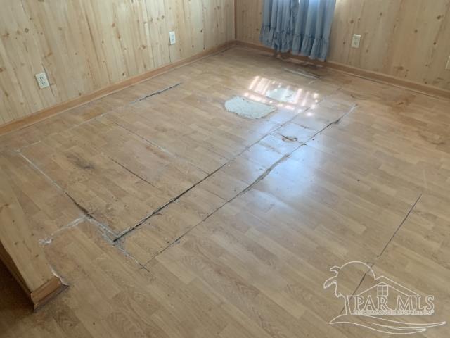 3281 Mason Road Walnut Hill, FL 32568 - Photo 29 of 41 a view of empty room with wooden floor