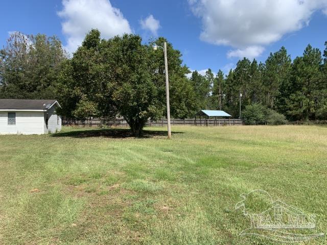 3281 Mason Road Walnut Hill, FL 32568 - Photo 3 of 41 a view of a house with a yard