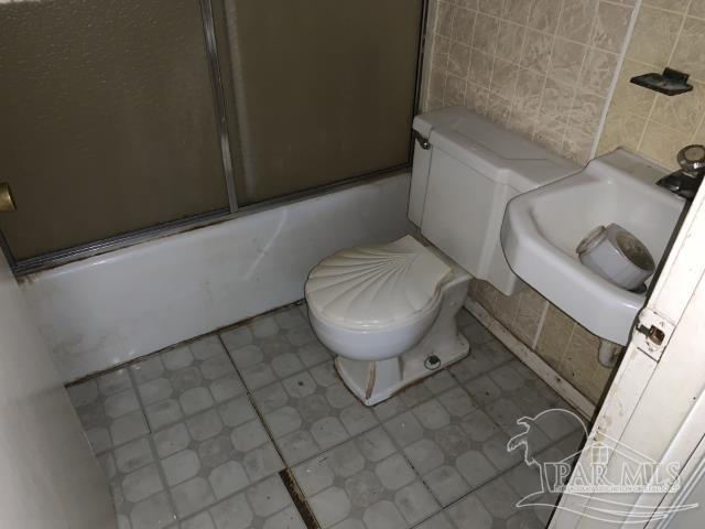 3281 Mason Road Walnut Hill, FL 32568 - Photo 39 of 41 a bathroom with a toilet and a sink