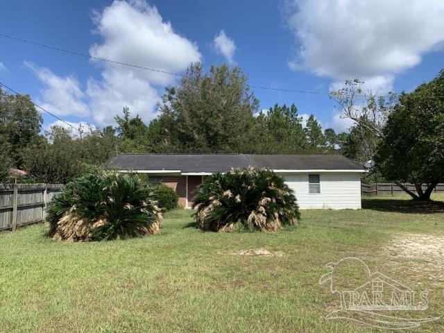 3281 Mason Road Walnut Hill, FL 32568 - Photo 5 of 41 a front view of house with yard and seating