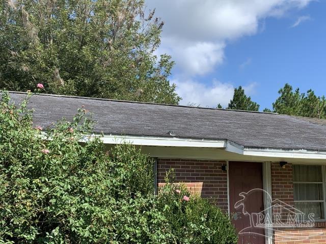 3281 Mason Road Walnut Hill, FL 32568 - Photo 6 of 41 a backyard of a house with seating space