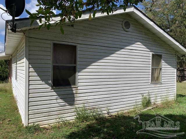 3281 Mason Road Walnut Hill, FL 32568 - Photo 9 of 41 a view of a house with a yard