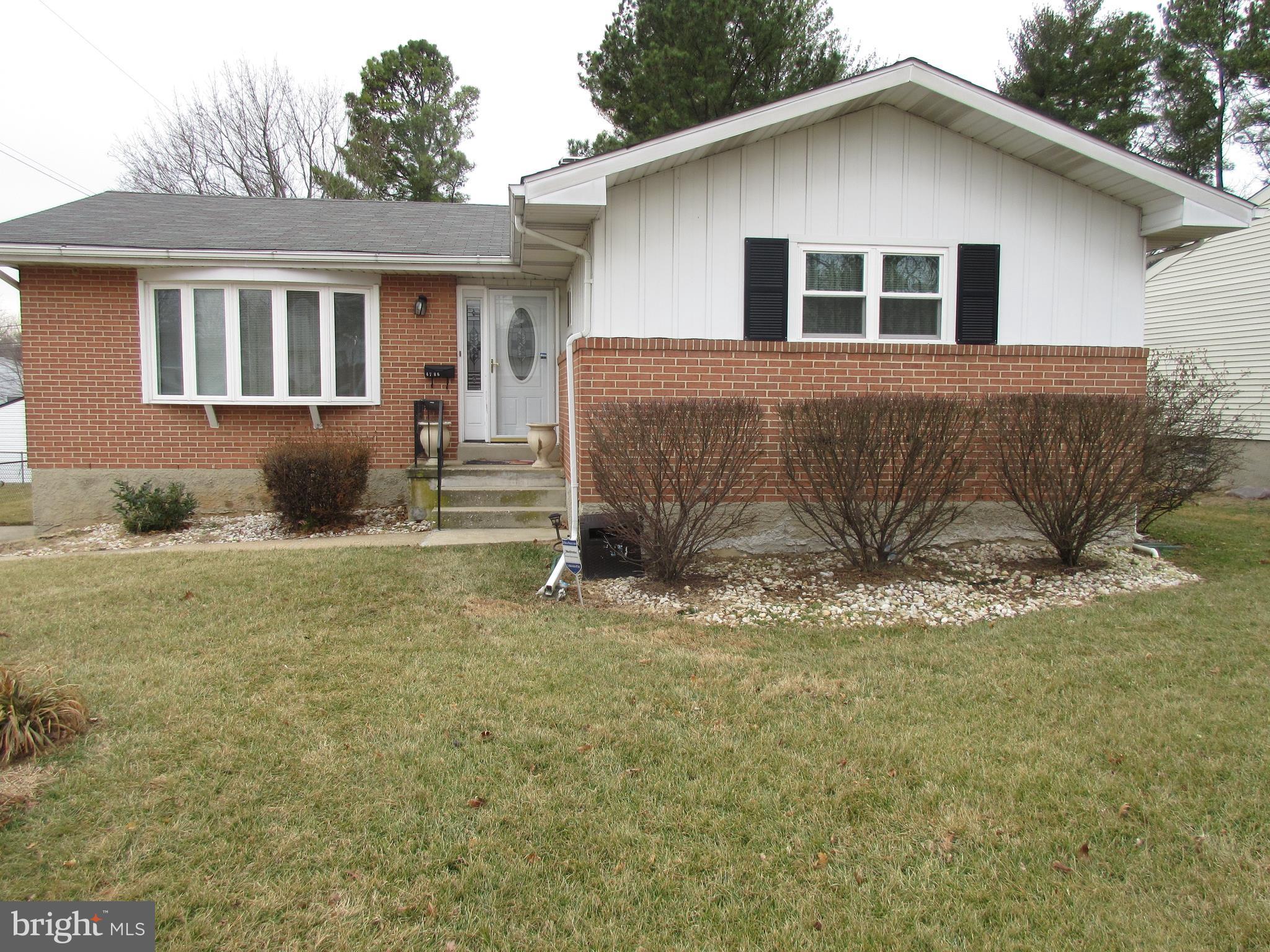 4786 Byron Road Baltimore, MD 21244 - Photo 2 of 30 a house that has a tree in front of it
