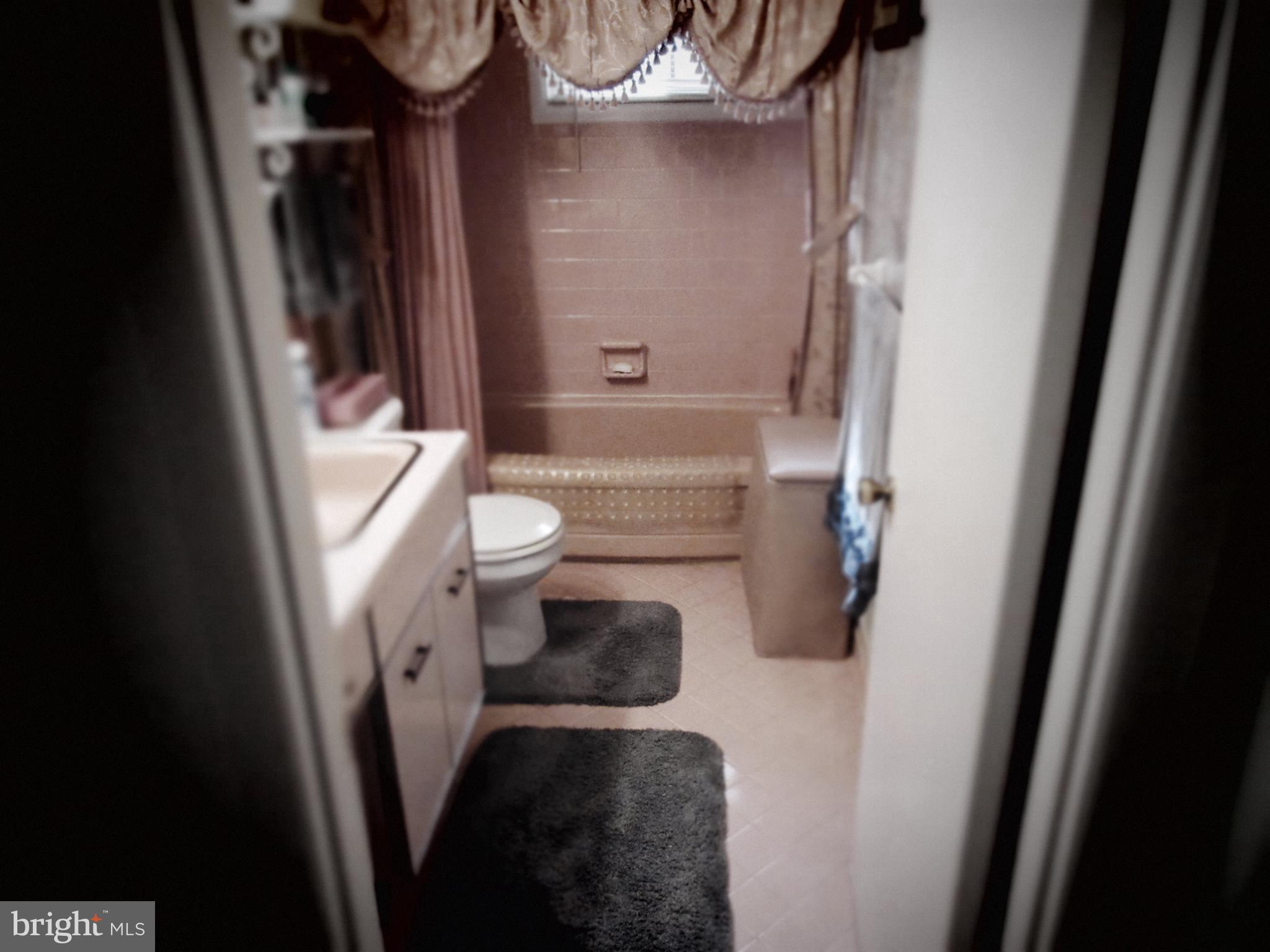 4786 Byron Road Baltimore, MD 21244 - Photo 17 of 30 a bathroom with a toilet and a shower