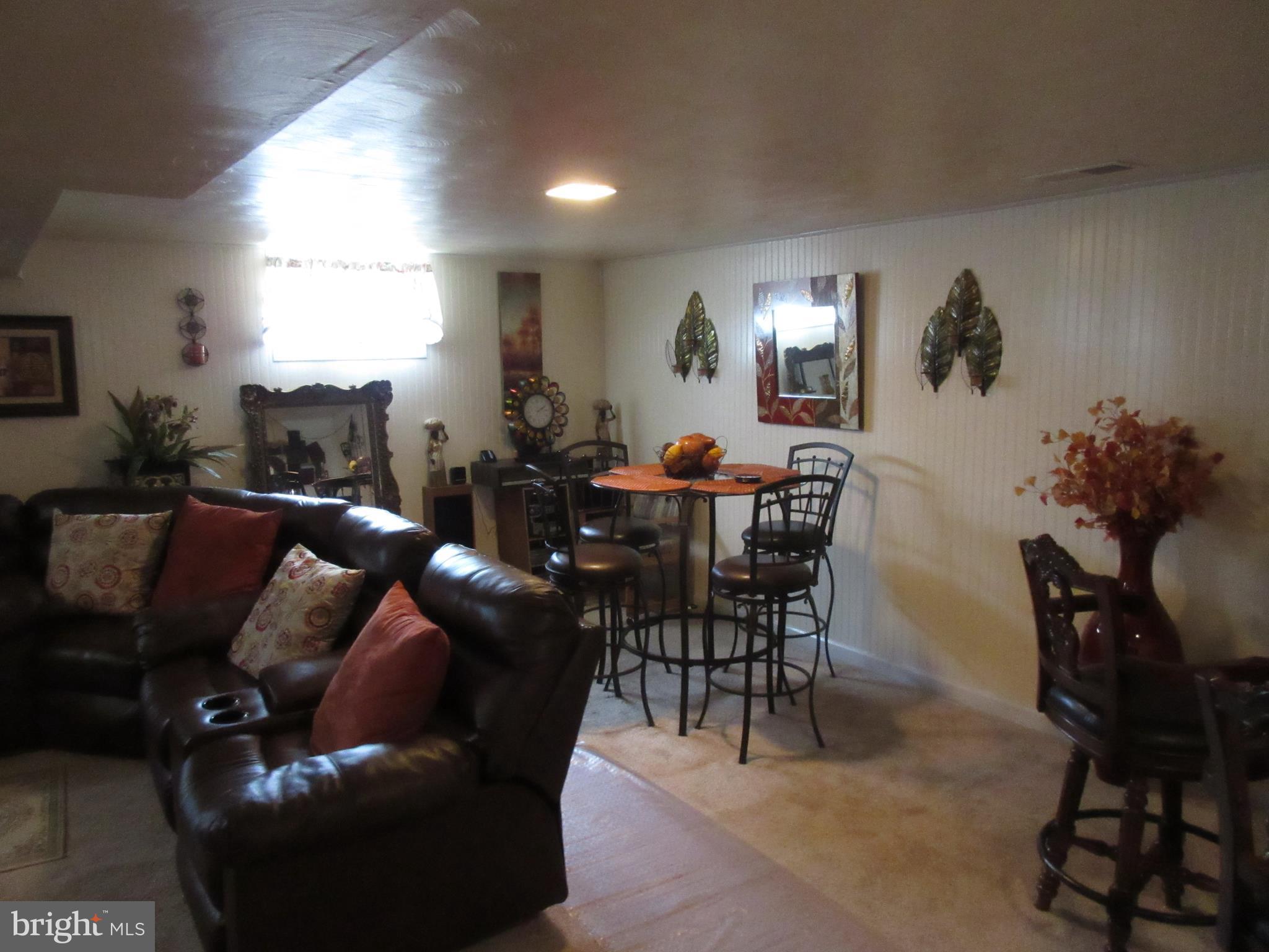 4786 Byron Road Baltimore, MD 21244 - Photo 18 of 30 a living room with furniture and wooden floor