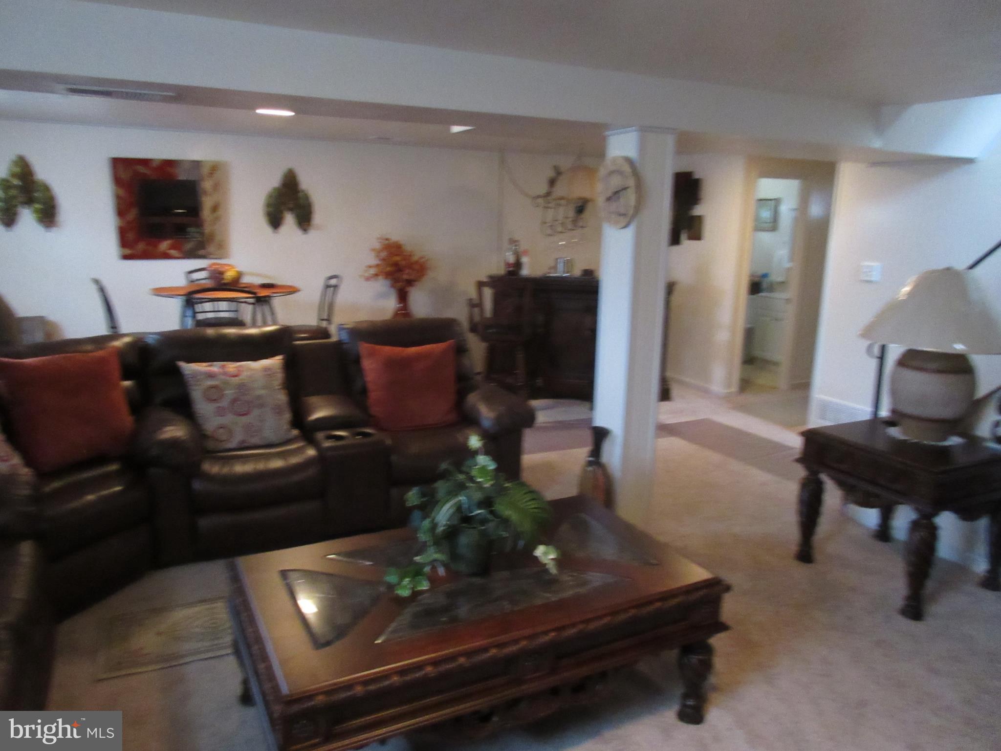 4786 Byron Road Baltimore, MD 21244 - Photo 21 of 30 a living room with furniture and a flat screen tv