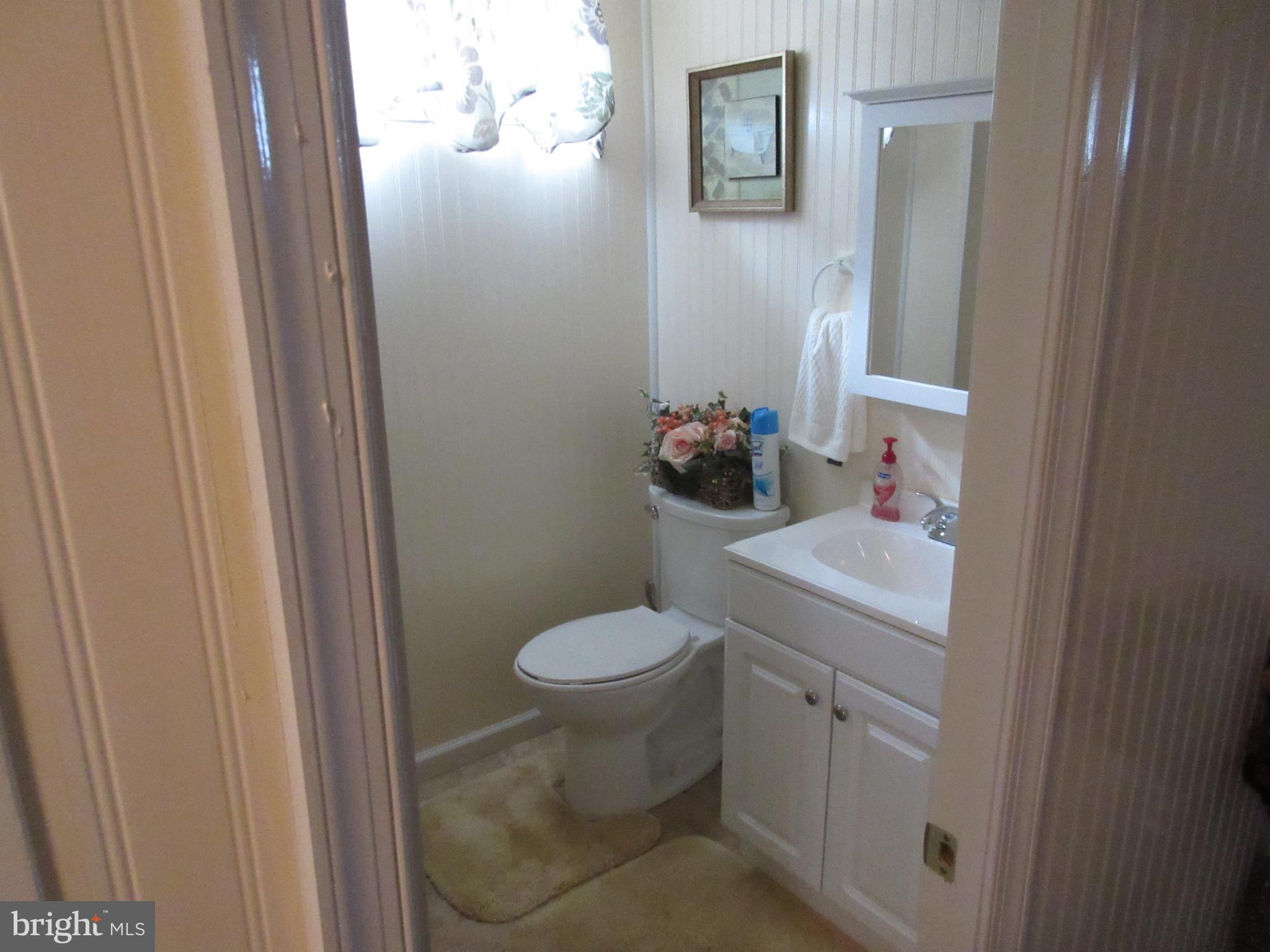 4786 Byron Road Baltimore, MD 21244 - Photo 22 of 30 a bathroom with a sink and toilet