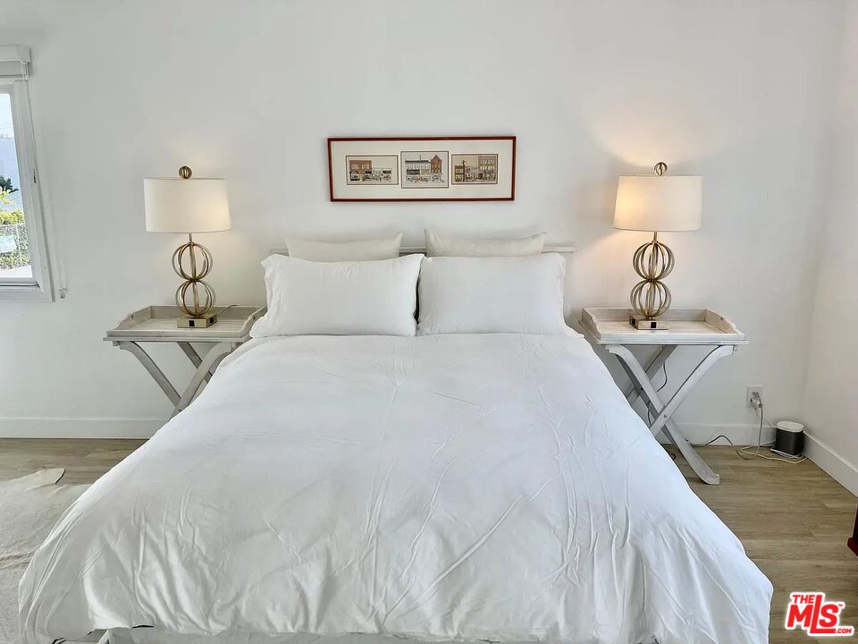 36 Anchorage Street, Unit 1 Venice, CA 90292 - Photo 13 of 32 a bed room with a bed and a night stand
