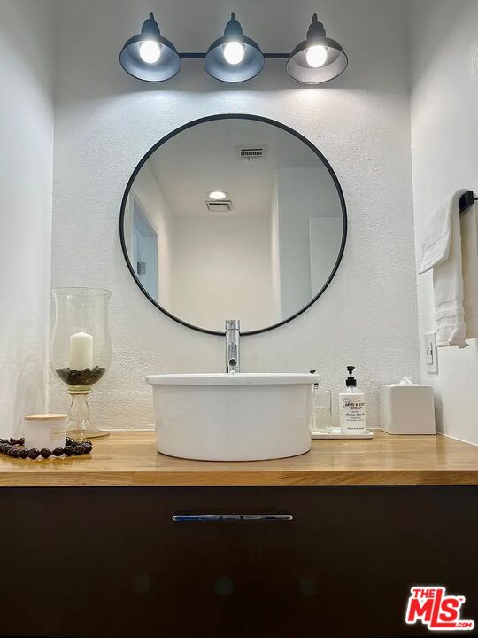 36 Anchorage Street, Unit 1 Venice, CA 90292 - Photo 16 of 32 a kitchen with a sink and a mirror