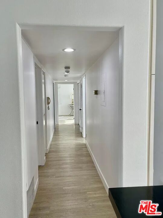 36 Anchorage Street, Unit 1 Venice, CA 90292 - Photo 24 of 32 a view of a hallway with wooden floor