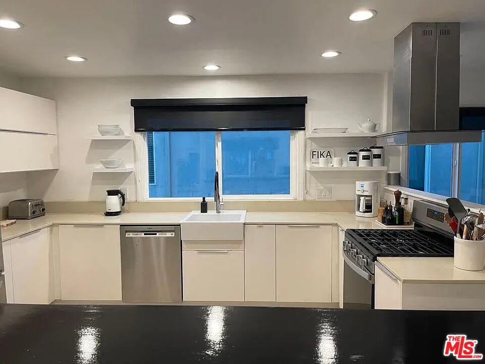 36 Anchorage Street, Unit 1 Venice, CA 90292 - Photo 5 of 32 a kitchen with stainless steel appliances a sink stove and cabinets