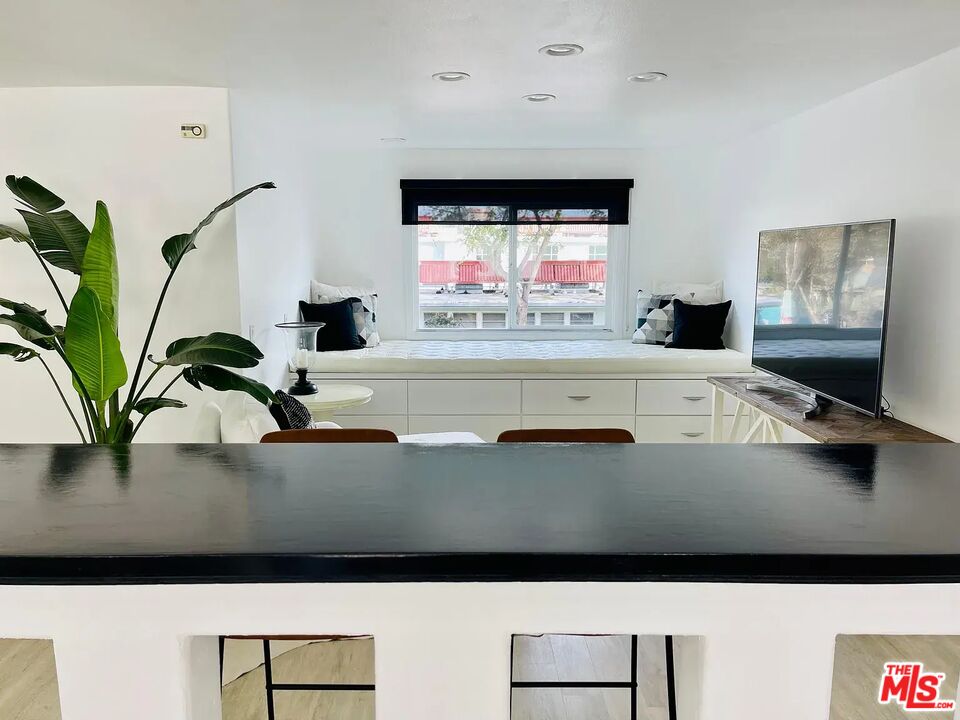 36 Anchorage Street, Unit 1 Venice, CA 90292 - Photo 6 of 32 a living room with furniture and a flat screen tv