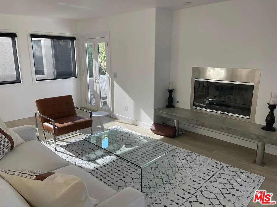 36 Anchorage Street, Unit 1 Venice, CA 90292 - Photo 9 of 32 a living room with furniture and a fireplace