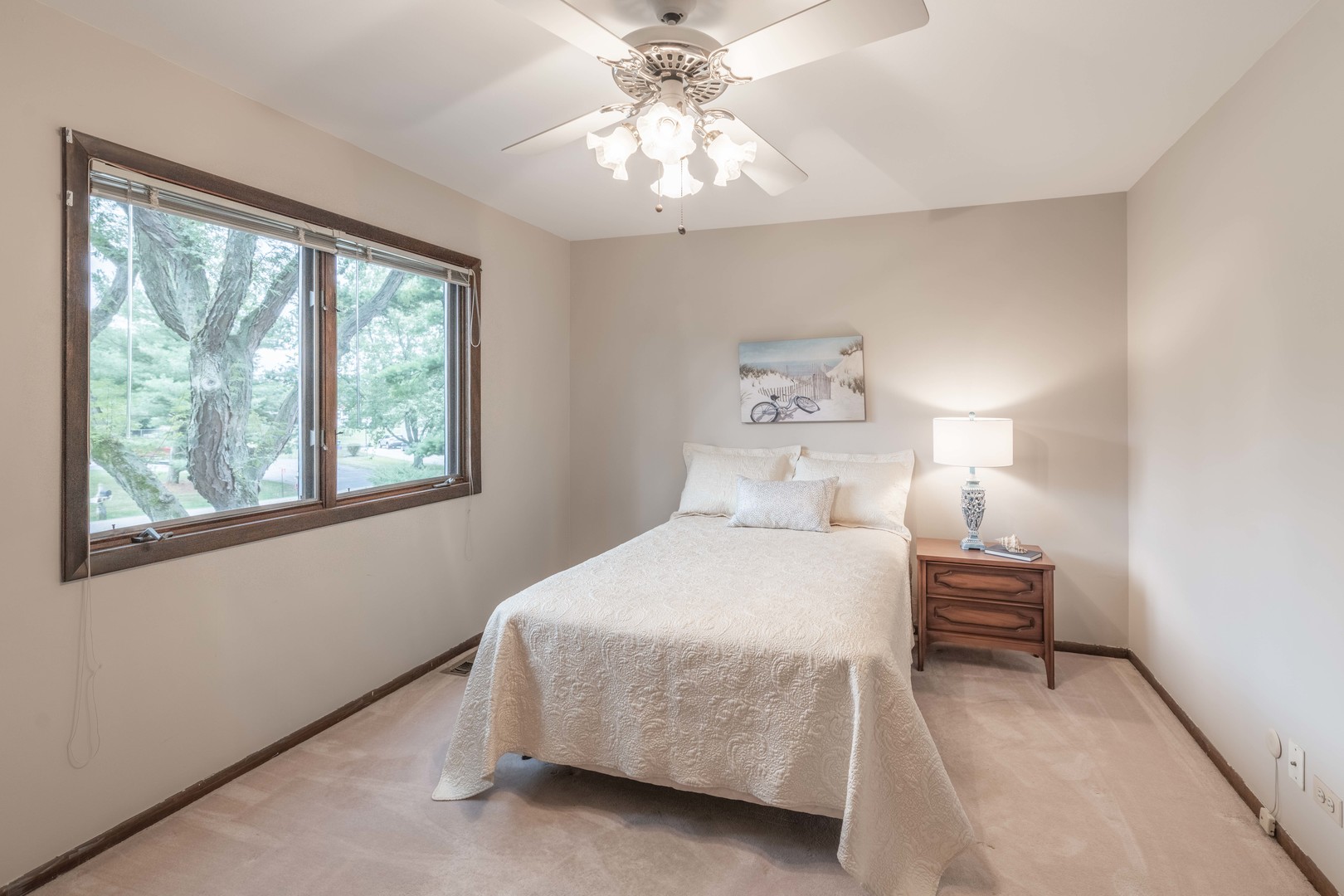 7N730 Sycamore Road St. Charles, IL 60175 - Photo 32 of 40 a bedroom with a bed and a chandelier