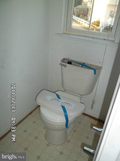 307 Sandy Spring Road Laurel, MD 20707 - Photo 2 of 18 a white toilet sitting next to a window