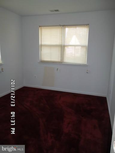 307 Sandy Spring Road Laurel, MD 20707 - Photo 17 of 18 a view of an empty room with a window