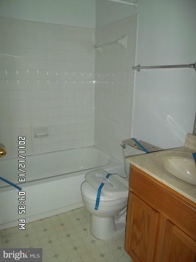 307 Sandy Spring Road Laurel, MD 20707 - Photo 18 of 18 a bathroom with a sink and a toilet