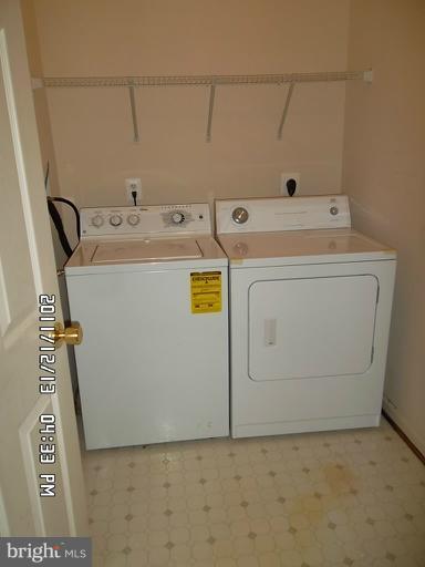 307 Sandy Spring Road Laurel, MD 20707 - Photo 10 of 18 a utility room with dryer and washer