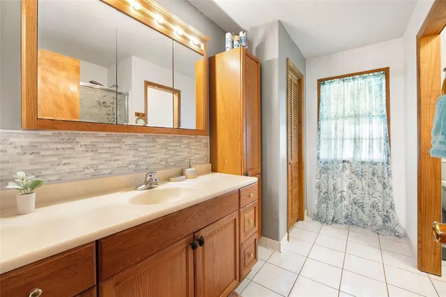a bathroom with a sink and a mirror