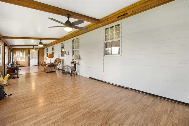 a view of a livingroom with wooden floor