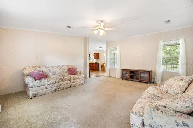 a living room with furniture and fireplace