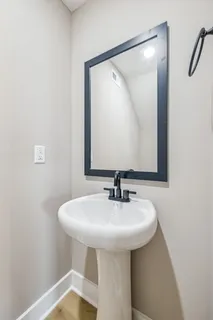 a bathroom with a sink and mirror
