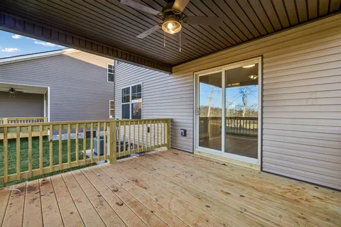 a view of balcony with wooden floor