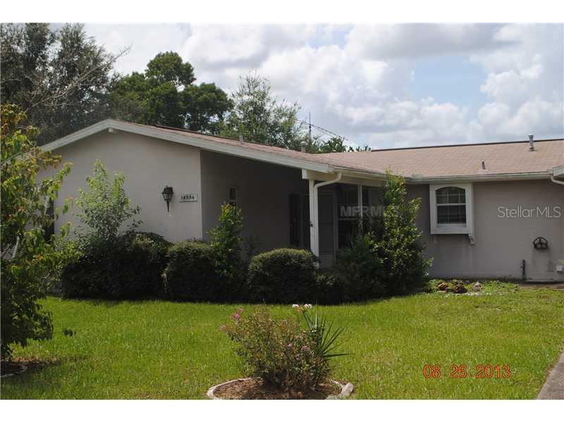 14556 Southwest 34th Terrace Road Ocala, FL 34473 - Photo 1 of 1 a view of a house with garden and plants