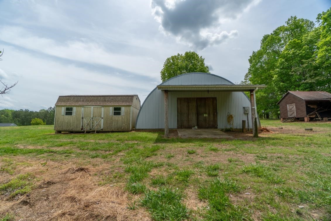 7810 Wiley Mangum Road Bahama, NC 27503 - Photo 37 of 52 Back View Quonset Building with Lean To
