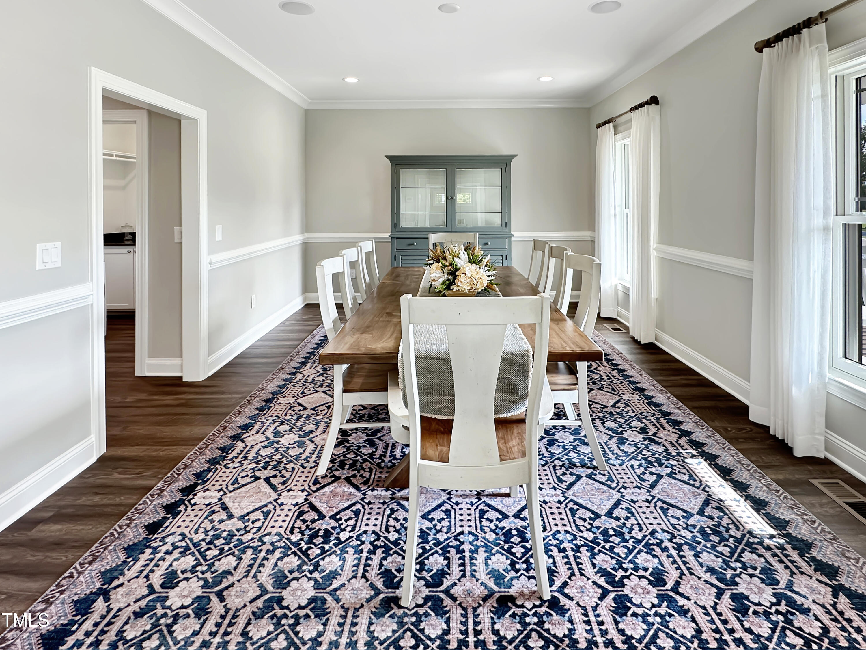8589 McGhees Mill Road Semora, NC 27343 - Photo 16 of 67 a dining room with a table and chairs