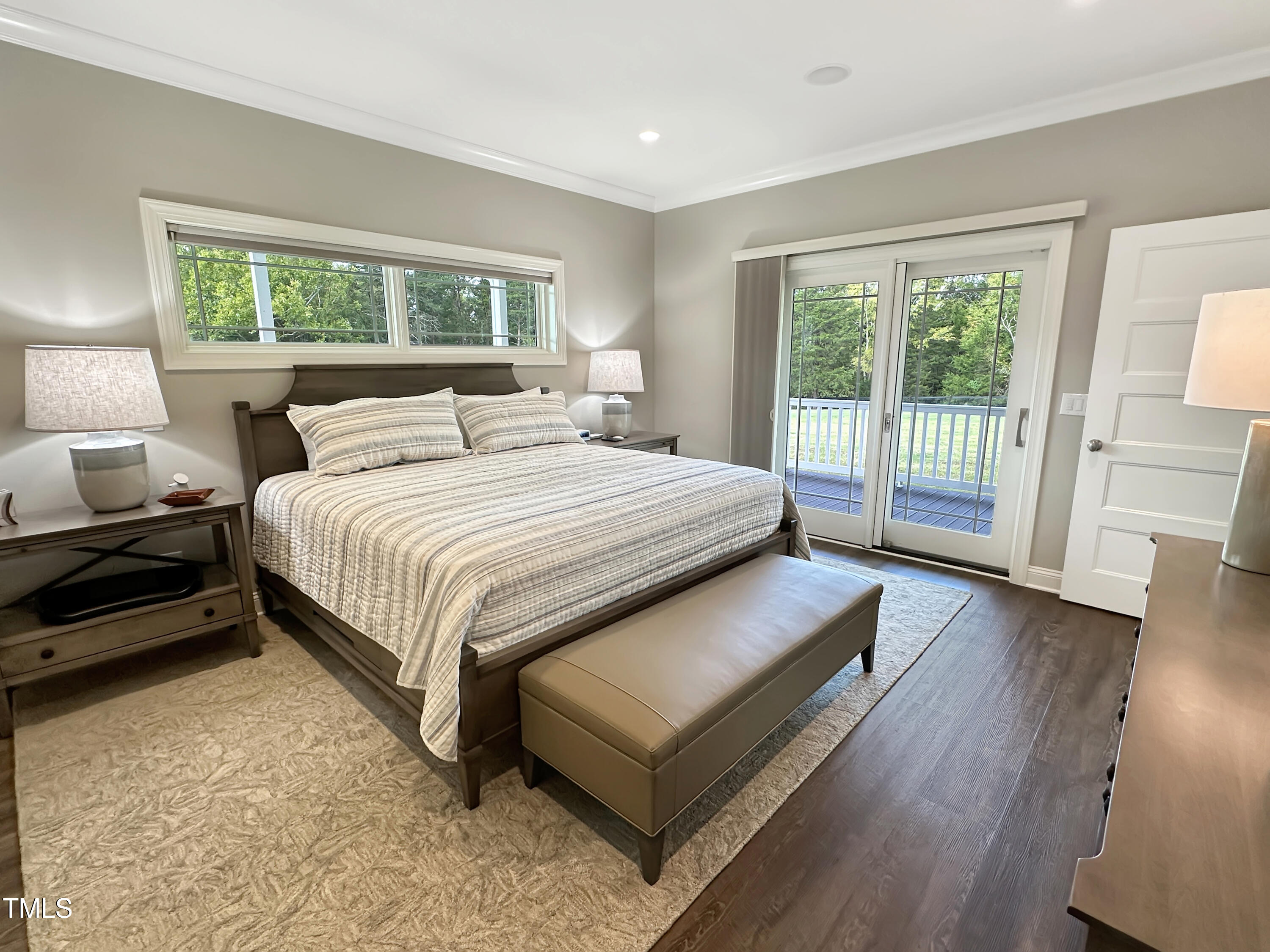 8589 McGhees Mill Road Semora, NC 27343 - Photo 18 of 67 a bed sitting in a bedroom next to a window