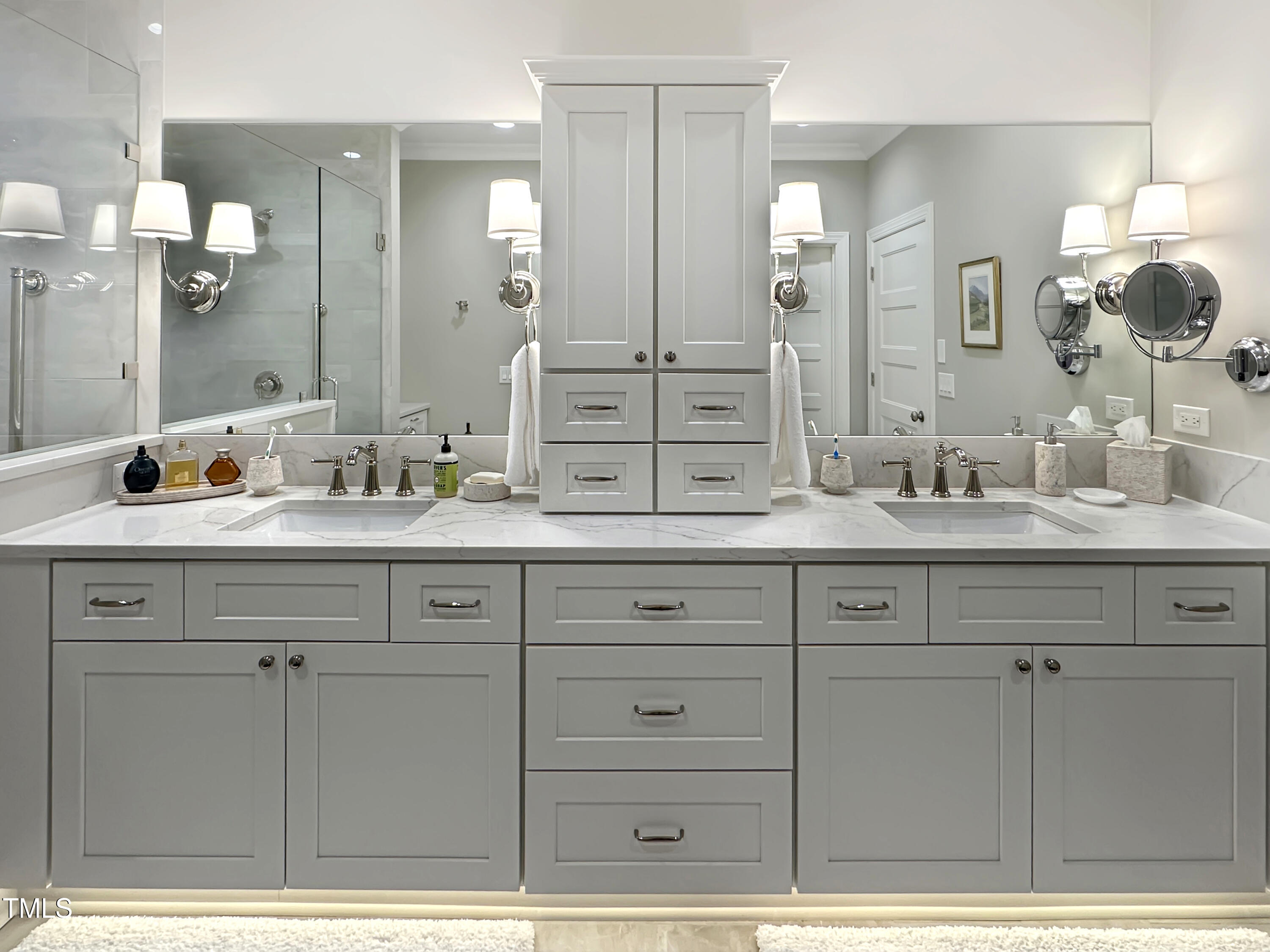 8589 McGhees Mill Road Semora, NC 27343 - Photo 20 of 67 a bathroom with a double vanity sink mirror and double