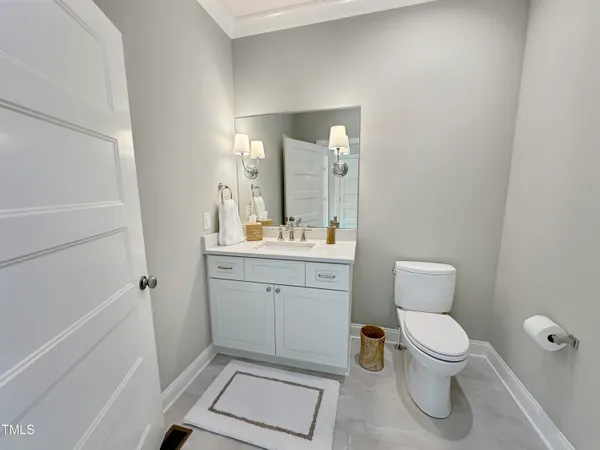 a spacious bathroom with double sink and a mirror