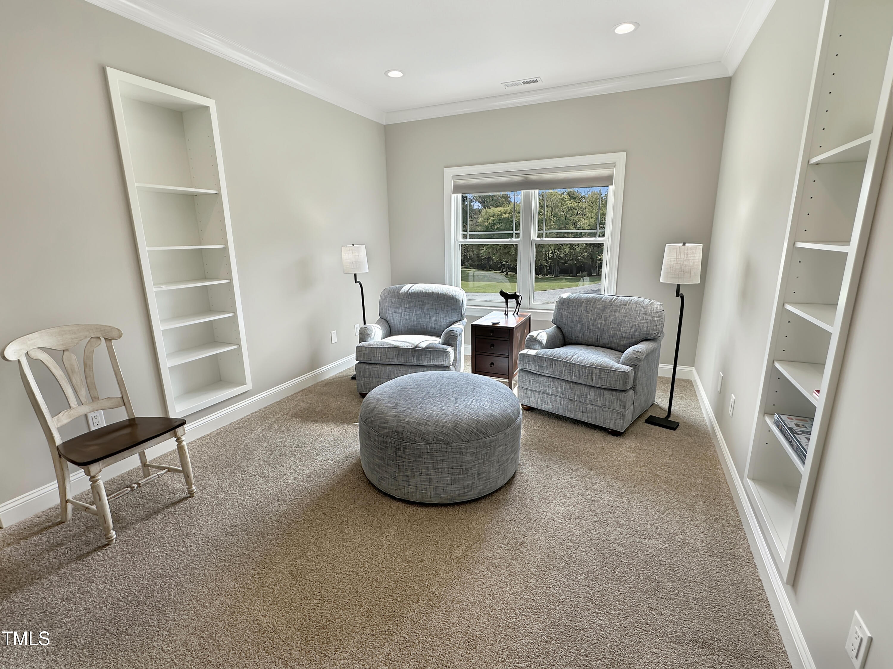 8589 McGhees Mill Road Semora, NC 27343 - Photo 24 of 67 a living room with furniture and a window
